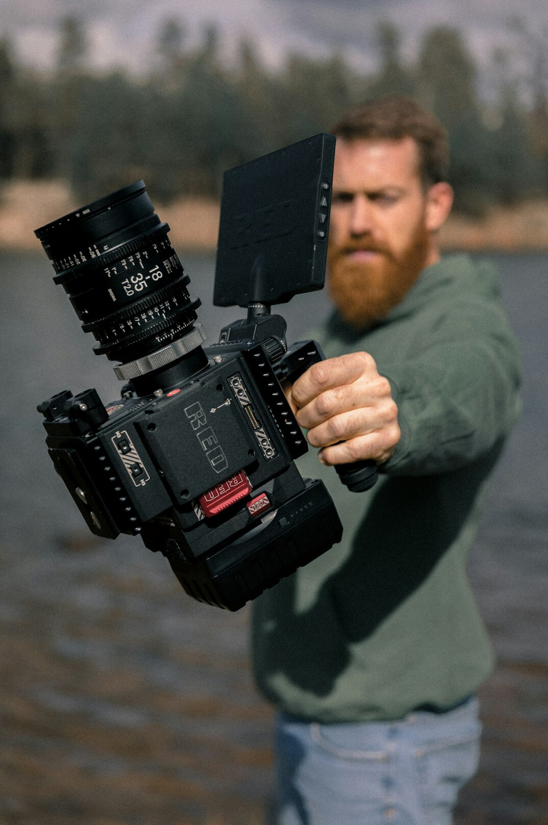 Portrait of a lead camera operator holding broadcast equipment